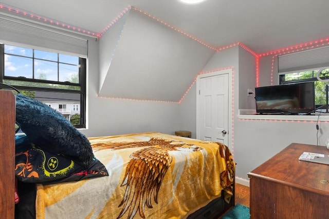 99 Lincoln St, Stoughton, MA 02072 - bedroom with multiple windows, wood finished floors, and vaulted ceiling