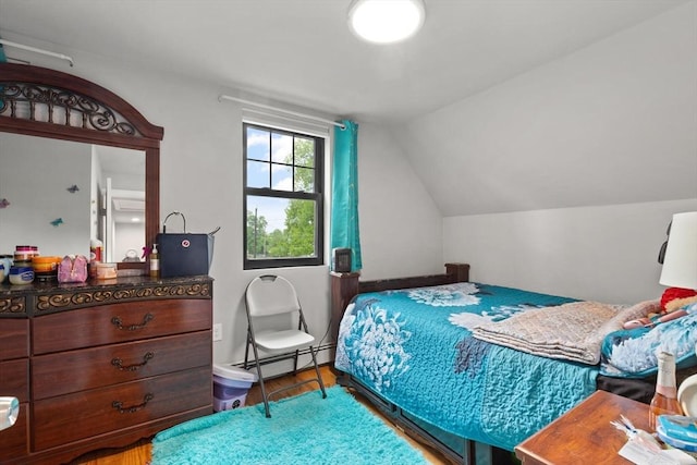 99 Lincoln St, Stoughton, MA 02072 - bedroom with a baseboard heating unit, wood finished floors, and lofted ceiling