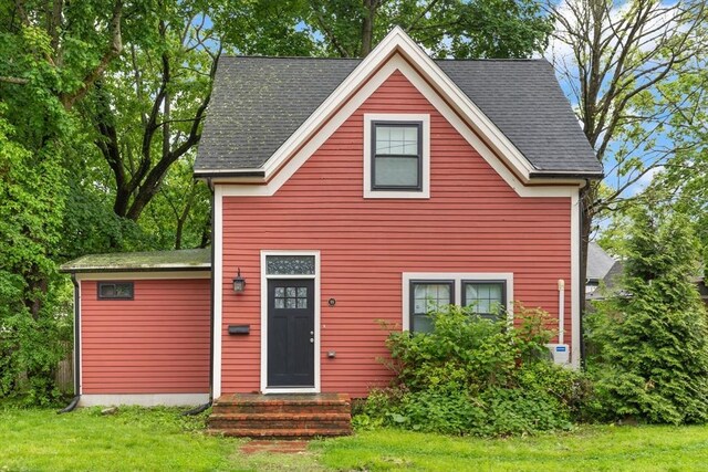 99 Lincoln St, Stoughton, MA 02072 - view of front of house with a front lawn and roof with shingles