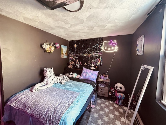 bedroom featuring a textured ceiling