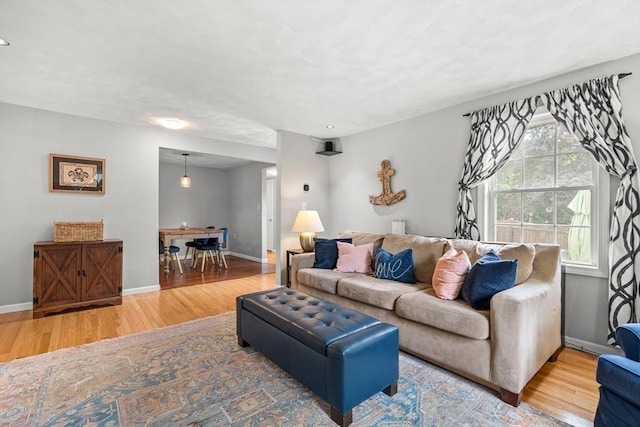 21 Forest St, Wilmington, MA 01887 - living room with wood finished floors, baseboards, and recessed lighting