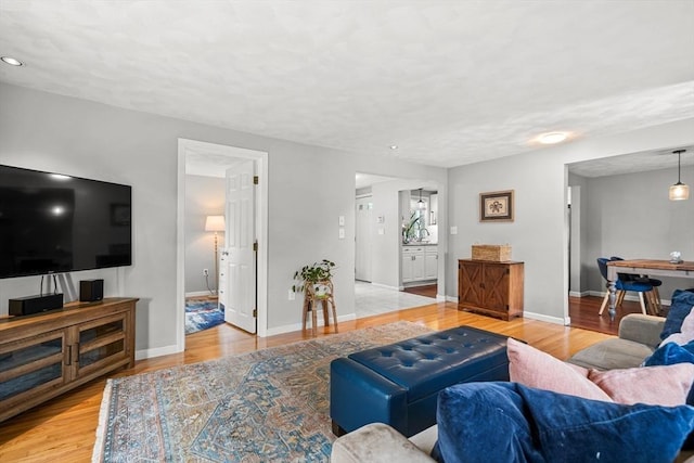 21 Forest St, Wilmington, MA 01887 - living area with light wood finished floors, baseboards, and recessed lighting