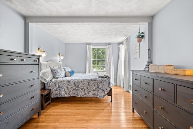 21 Forest St, Wilmington, MA 01887 - bedroom with light wood-style floors and a textured ceiling