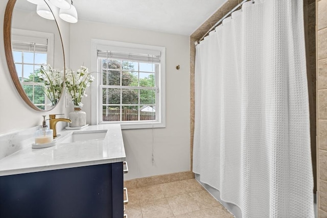 21 Forest St, Wilmington, MA 01887 - full bathroom with vanity, plenty of natural light, tile patterned flooring, and a shower with shower curtain