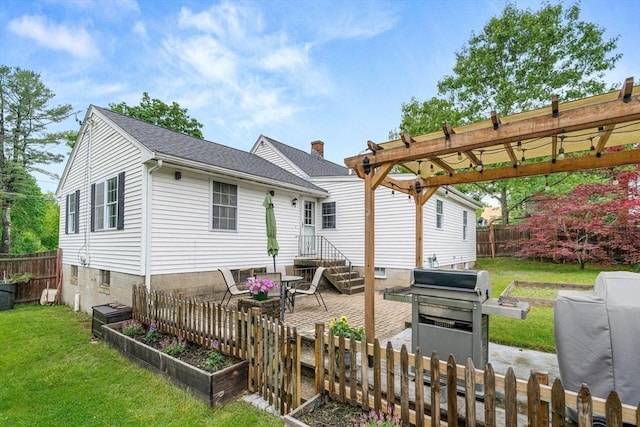 21 Forest St, Wilmington, MA 01887 - back of property featuring a vegetable garden, a patio, roof with shingles, and a pergola
