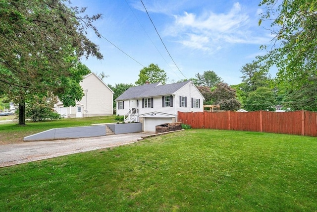 21 Forest St, Wilmington, MA 01887 - view of front facade featuring an attached garage and driveway