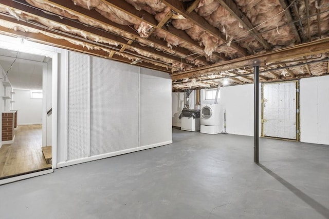 basement featuring washing machine and clothes dryer