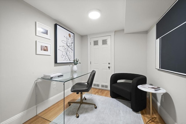 home office featuring light hardwood / wood-style floors