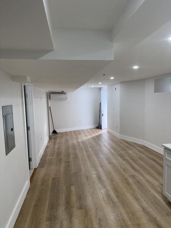 567 Park St Unit 1And B, Boston, MA 02124 - finished below grade area featuring wood finished floors, recessed lighting, electric panel, baseboards, and a wall mounted AC