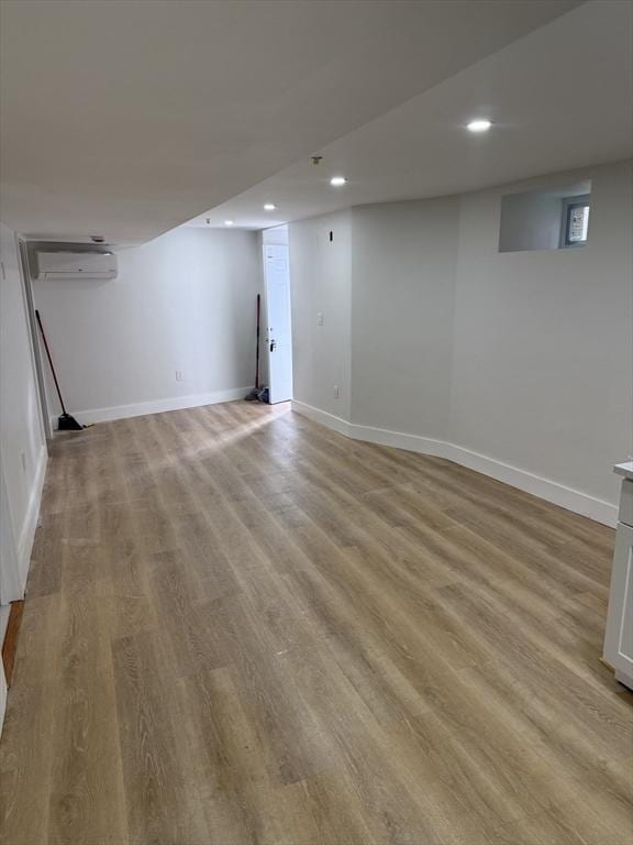 567 Park St Unit 1And B, Boston, MA 02124 - finished basement featuring light wood-type flooring, recessed lighting, a wall mounted air conditioner, and baseboards