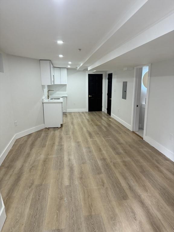 567 Park St Unit 1And B, Boston, MA 02124 - unfurnished living room featuring electric panel, light wood-style floors, baseboards, a sink, and recessed lighting