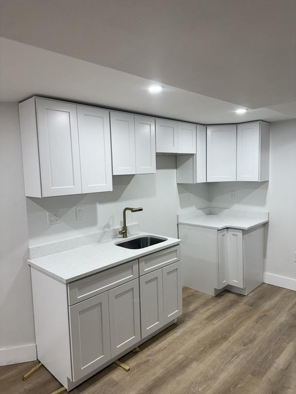 567 Park St Unit 1And B, Boston, MA 02124 - kitchen featuring baseboards, a sink, light wood-type flooring, light countertops, and recessed lighting