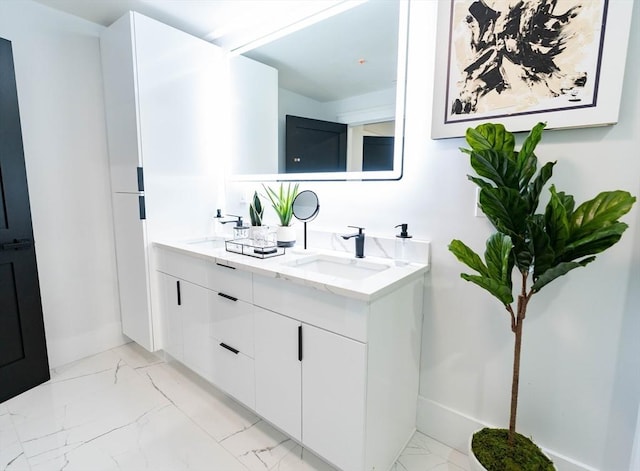 567 Park St Unit 1And B, Boston, MA 02124 - bathroom with marble look tile flooring, double vanity, and baseboards