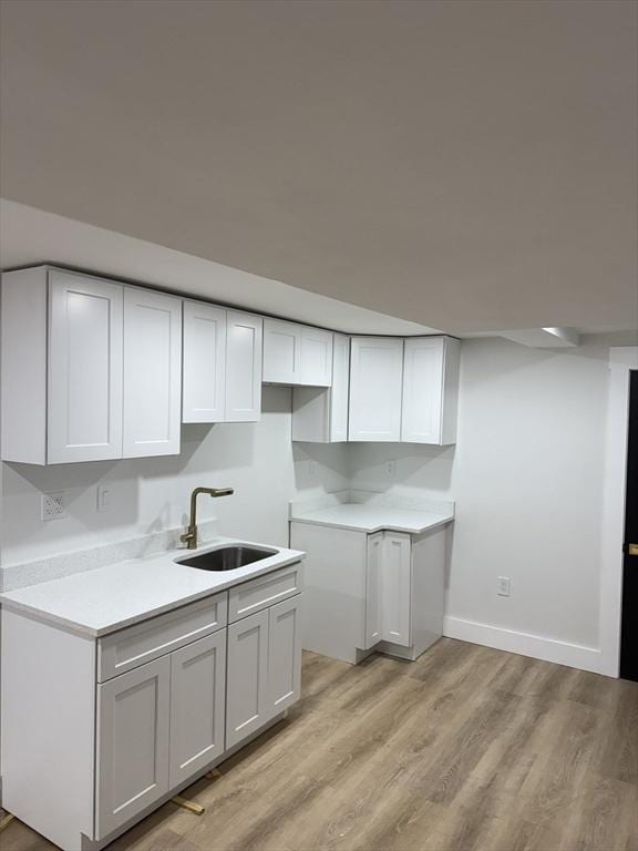 567 Park St Unit 1And B, Boston, MA 02124 - kitchen featuring a sink, light wood finished floors, baseboards, and light countertops