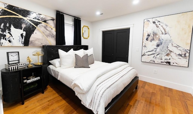 567 Park St Unit 1And B, Boston, MA 02124 - bedroom featuring light wood-style flooring, baseboards, a closet, and recessed lighting
