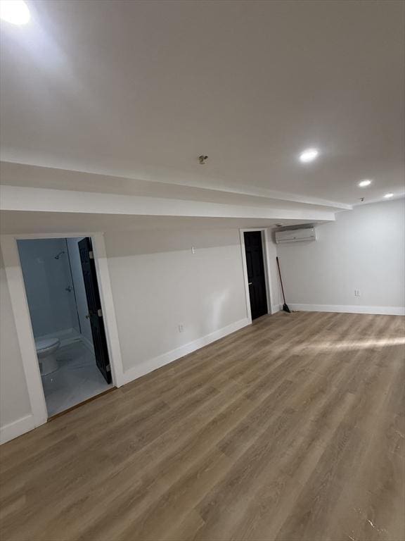 567 Park St Unit 1And B, Boston, MA 02124 - finished below grade area featuring an AC wall unit, baseboards, wood finished floors, and recessed lighting