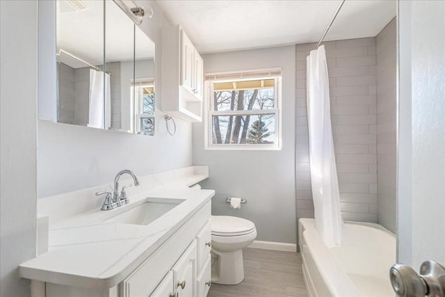 full bathroom featuring shower / tub combo with curtain, vanity, toilet, and wood-type flooring