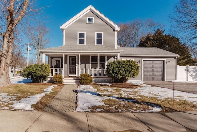 view of front of house featuring a garage and a porch