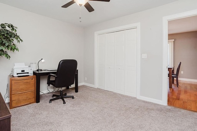 office featuring light colored carpet and ceiling fan