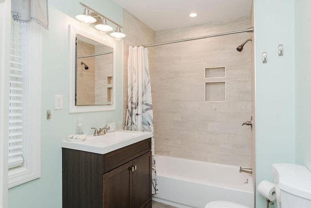 full bathroom with vanity, toilet, and shower / bathtub combination with curtain