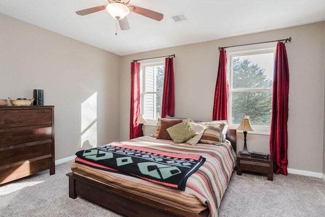 bedroom featuring light carpet and ceiling fan