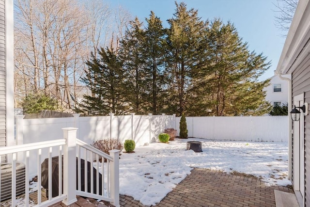 yard covered in snow with cooling unit