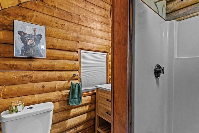 125 Blackstone St, Uxbridge, MA 01569 - bathroom featuring rustic walls, toilet, a shower, and vanity