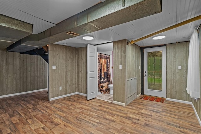 125 Blackstone St, Uxbridge, MA 01569 - basement with wood finished floors, wooden walls, and baseboards