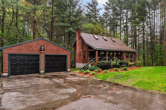125 Blackstone St, Uxbridge, MA 01569 - view of front facade featuring a chimney, an outdoor structure, a porch, a front yard, and a detached garage
