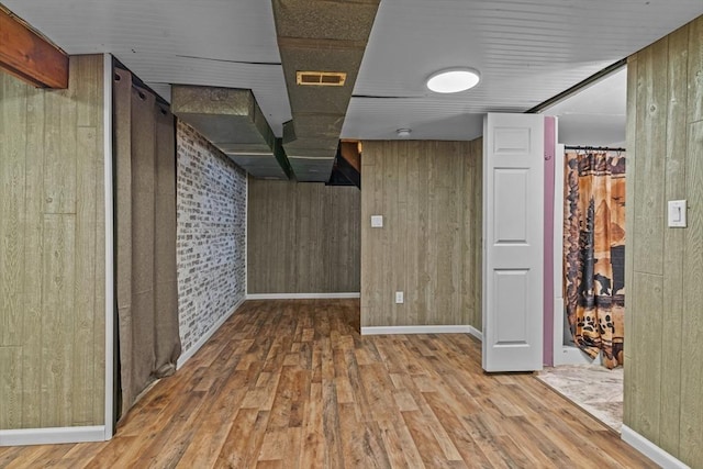 125 Blackstone St, Uxbridge, MA 01569 - finished basement featuring wood finished floors, baseboards, and wood walls