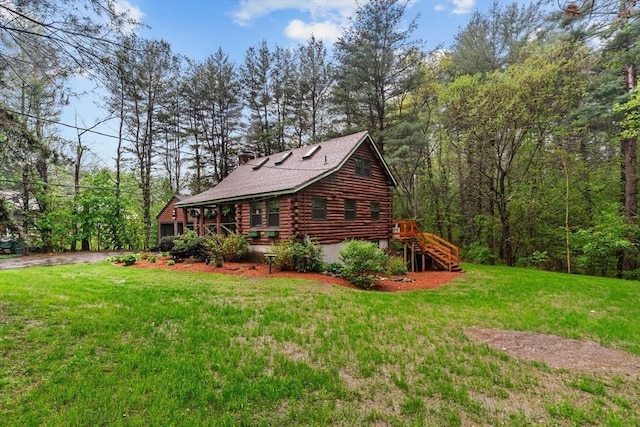 125 Blackstone St, Uxbridge, MA 01569 - view of side of home featuring log exterior and a lawn