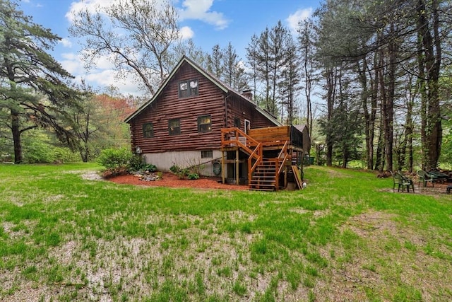 125 Blackstone St, Uxbridge, MA 01569 - back of house with a chimney, a deck, log exterior, and a lawn