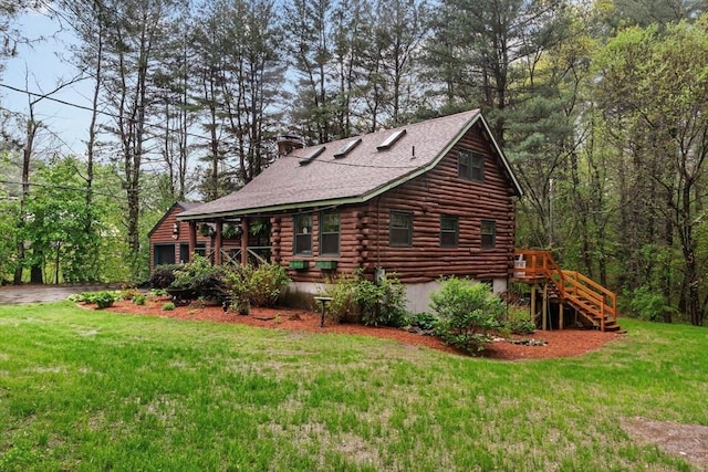 125 Blackstone St, Uxbridge, MA 01569 - view of side of property with log siding, a lawn, a chimney, and stairway