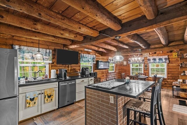 125 Blackstone St, Uxbridge, MA 01569 - kitchen with appliances with stainless steel finishes, wooden ceiling, hardwood / wood-style floors, dark countertops, and beam ceiling