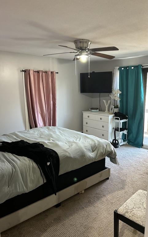 carpeted bedroom with ceiling fan