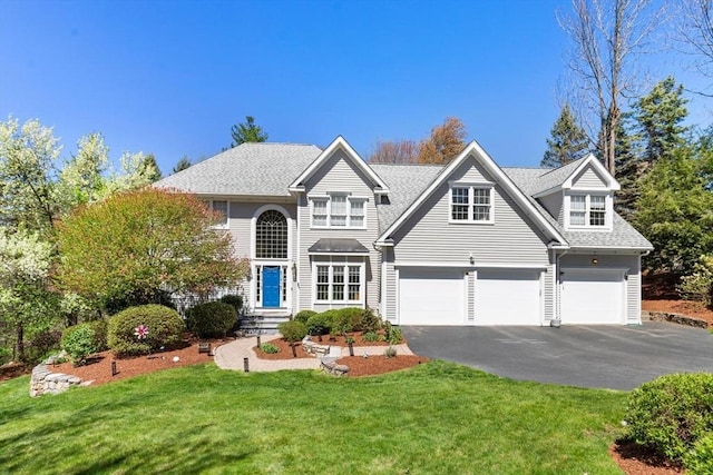 3 Anders Way, Acton, MA 01720 - view of front of house featuring asphalt driveway, an attached garage, a front lawn, and roof with shingles