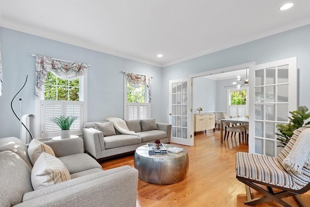 3 Anders Way, Acton, MA 01720 - living area featuring crown molding, recessed lighting, light wood-style flooring, french doors, and a chandelier
