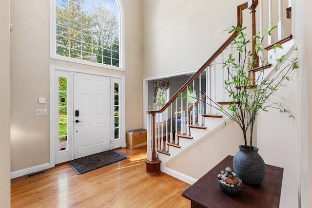 3 Anders Way, Acton, MA 01720 - foyer featuring healthy amount of natural light, a high ceiling, wood finished floors, stairway, and baseboards