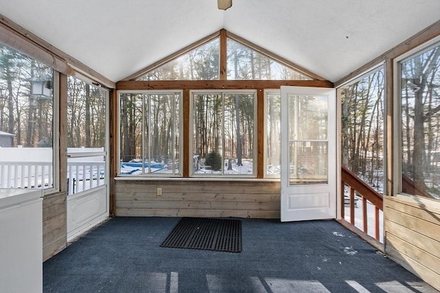 unfurnished sunroom with vaulted ceiling