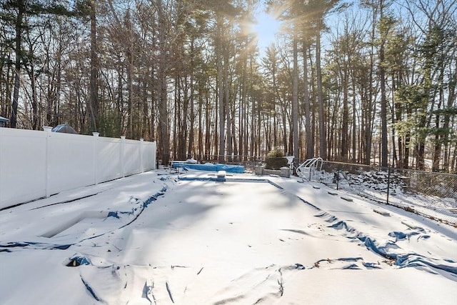 view of yard covered in snow