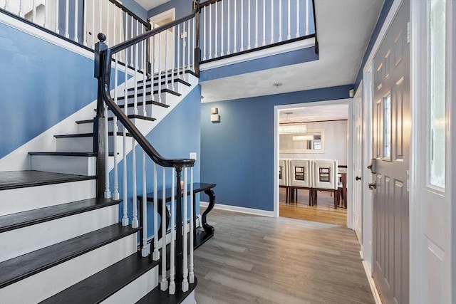 stairs with wood-type flooring