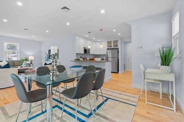 31-33 New Ocean St, Swampscott, MA 01907 - dining room with light wood-style flooring and recessed lighting