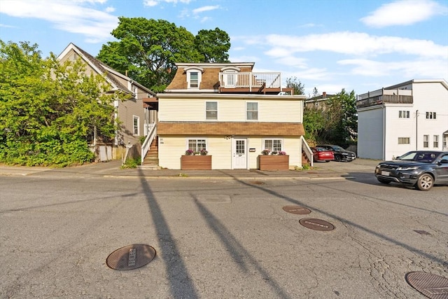 31-33 New Ocean St, Swampscott, MA 01907 - view of front of property with a balcony, stairs, and roof with shingles