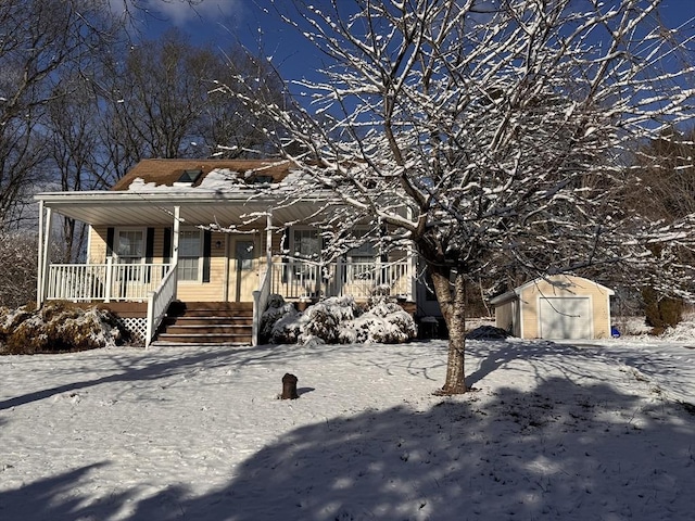 view of front of house featuring a storage unit and covered porch