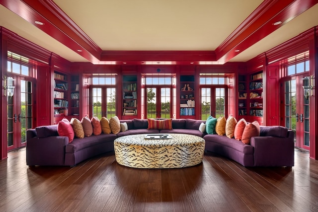 living room featuring crown molding, dark hardwood / wood-style flooring, and french doors