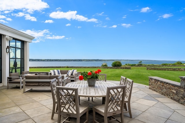 view of patio / terrace featuring an outdoor hangout area and a water view