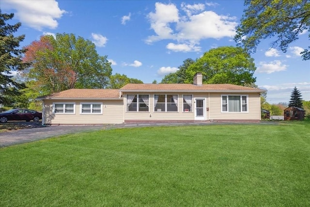 7 Wilbur Ct, Saugus, MA 01906 - view of front of property featuring a front lawn and a chimney
