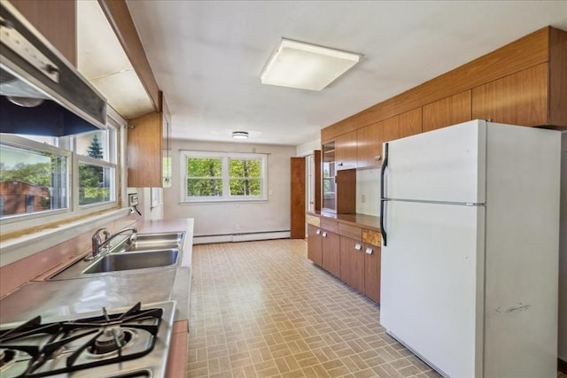 7 Wilbur Ct, Saugus, MA 01906 - kitchen with freestanding refrigerator, baseboard heating, brown cabinetry, and range