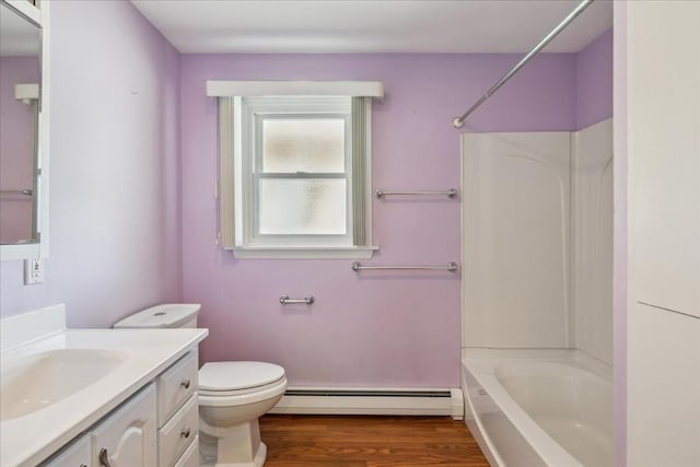 7 Wilbur Ct, Saugus, MA 01906 - bathroom featuring a baseboard heating unit, vanity, toilet, wood finished floors, and  shower combination