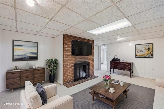 7 Wilbur Ct, Saugus, MA 01906 - living area with carpet, a fireplace, and a paneled ceiling